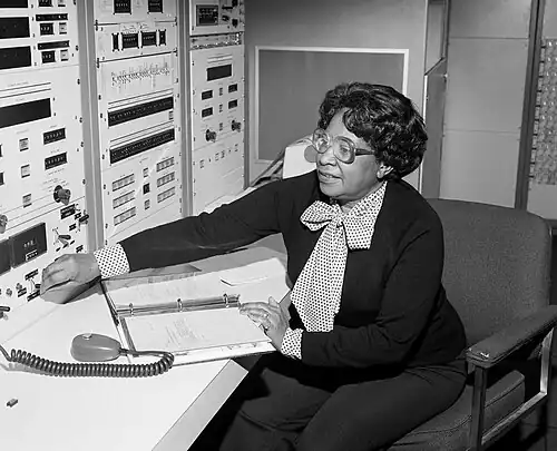 Mary Jackson sitting, adjusting a control on an instrument