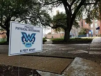 Physical distance sign behind Callaway Hall