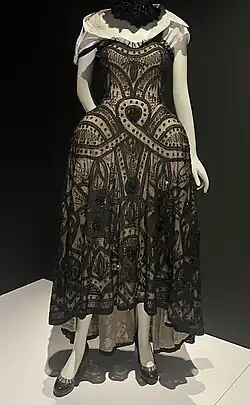 White dress with black lace overlay and padded hips