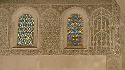 Coloured glass windows above in the prayer hall, with stucco grilles and surrounding stucco decoration