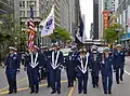Members of the U.S. Coast Guard and Coast Guard Auxiliary march in a Memorial Day parade in Chicago