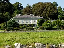 a large house surrounded by trees