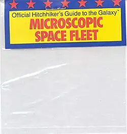 An empty plastic bag, with a cardboard label that reads "Official Hitchhiker's Guide to the Galaxy Microscopic Space Fleet"