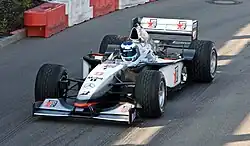 Häkkinen driving a McLaren MP4/13 in its non-tobacco livery