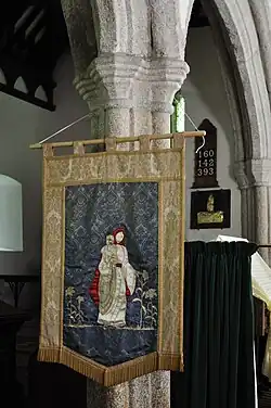 St Materiana depicted on the church banner at Minster, Cornwall.