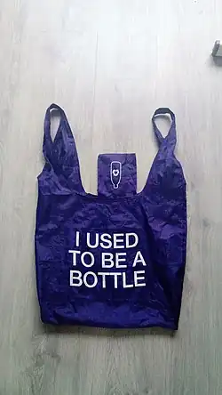 Photograph of a re-usable carrier bag made from recycled plastic bottles processed using open-loop recycling.