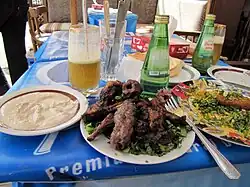 Egyptian koftet el hati on a mixed grill platter, served with tehina