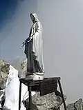 Mont Dolent summit statue, bearing inscription.