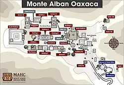 A detailed, top-down map of the Monte Albán archaeological zone, showing pyramids, platforms, temples, and walking paths in a handmade illustrated style.