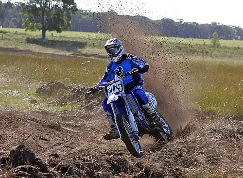 Image 2 Motocross Credit: Fir0002 Motocross is form of motorcycle or ATV racing held on enclosed off-road circuits. The tracks are often quite large, natural, terrains with very few man made jumps, unlike Supercross, a sport that was originally derived from Motocross and is executed on a smaller track with many more extreme man made obstacles. More selected pictures