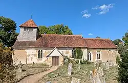 The parish church dedicated to Saint Andrew, at the village of Mottisfont in Hampshire, England. August 2025.