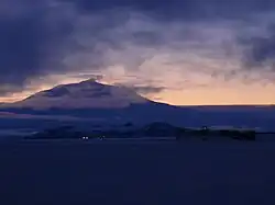 Ross Island's Mount Erebus looms over McMurdo and Scott in the polar twilight