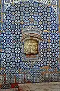 The shrine is covered in blue tile-work that is typical of Multani style.