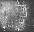 Altitude: 11 miles (18 km). Features: Crater near upper left of area outlined in white.