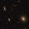 NGC 3557 (right), NGC 3564 (lower-left), and NGC 3568 (upper-left).