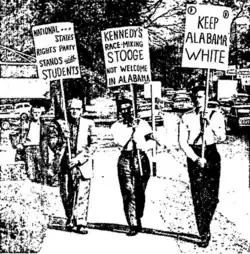 neo-Nazis holding signs