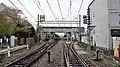 The station viewed from the level crossing at the east (Ikebukuro) end in April 2016