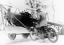 Nassau County deputy sheriff tickets Lawrence Sperry after landing a plane in the street, circa 1922.[11]