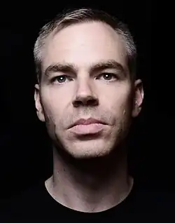 Close-up of Nate Kinsella's face with a black background