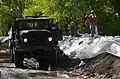 North Dakota National Guard soldiers place poly over temporary emergency levee on June 2, 2011.