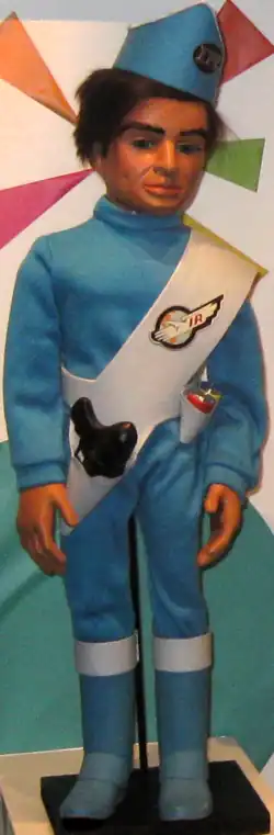 A marionette puppet wearing a military-style uniform featuring a cap, baldric and boots.