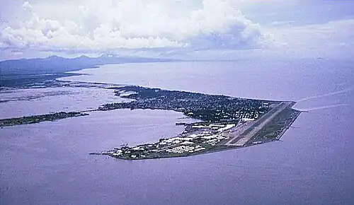 Aerial view of base and Cavite City (c. 1964), on Cavite Peninsula in Manila Bay.