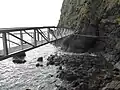 New bridge and old bridge remains at The Gobbins