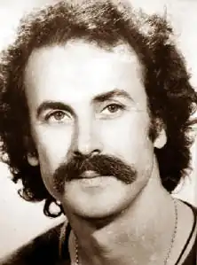 Portrait of Nikos Xylouris, renowned Greek singer and composer, known for his contributions to Cretan and Éntekhno music.