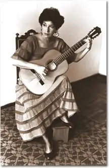 Nilda Urquiza plays guitar