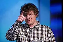 Monsen on stage during a media conference