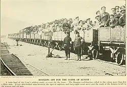 Train carrying Russian soldiers to the front. Photograph by Charles Morris, August 1914.