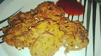 Onion fritters (Peyaji) are a Bengali dish made with onions