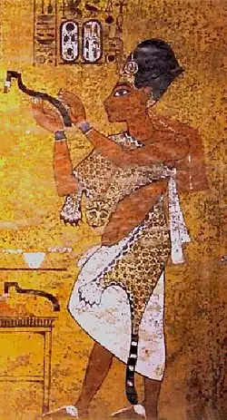 Pharaoh Ay depicted in KV62 performing the Opening of the mouth ceremony on his predecessor Tutankhamun.