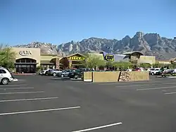 Photo shows Ulta, Tilly's and Best Buy stores at the Oro Valley Marketplace with Pusch Ridge rising in the background.