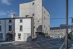 A street corner with a three-storey cinema located at its apex