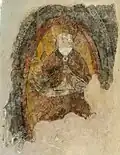 Remains of a 16th-century wall painting in a chapel of the south transept.