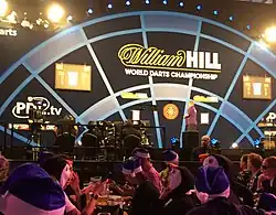 A distant view of the World Championship stage from a table in the crowd.