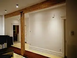 An apartment with an exposed PSL beam and column