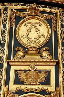 Baroque acanthuses of a monogram of Louis XIV on the entrance door of the Dôme des Invalides, Paris, by Jules Hardouin-Mansart, 1677–1706[11]