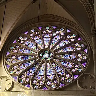 Rose window in the left transept, created by Émile Thibaut.