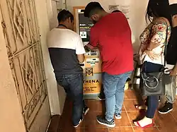 Salvadorans using an Athena Bitcoin ATM