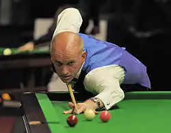 Peter Ebdon playing a shot on the table
