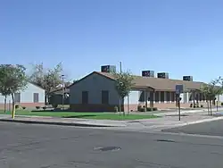 The Marcos de Niza Housing Project was established by Father Emmett McLoughlin in 1941. The housing project is located at 305 W. Pima St. This property is recognized as historic by the Hispanic American Historic Property Survey of the City of Phoenix.