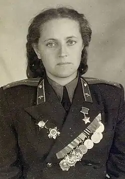postwar portrait photograph of Zhigulenko wearing her military medals