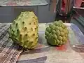Sugar apple (right), with Taiwanese "pineapple shijia" (atemoya) (left)