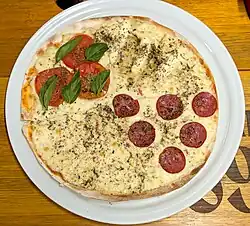 Unusual four-flavored pizza ("four seasons") served at a supermarket in Rio de Janeiro
