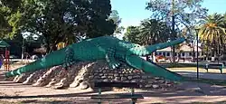 Image of a large alligator sculpture in Plaza Sarmiento, Caimancito, Argentina.