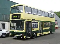 Light cream and two-tone gren double-decker bus