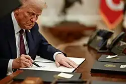 President Donald Trump signing executive orders