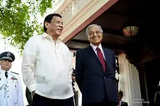 President Rodrigo Duterte shares a light moment with Malaysian Prime Minister Mahathir Mohamad after the latter was accorded arrival honors at the Malacañang Palace on March 7, 2019